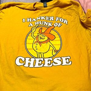 It’s a mustard yellow shirt with a design